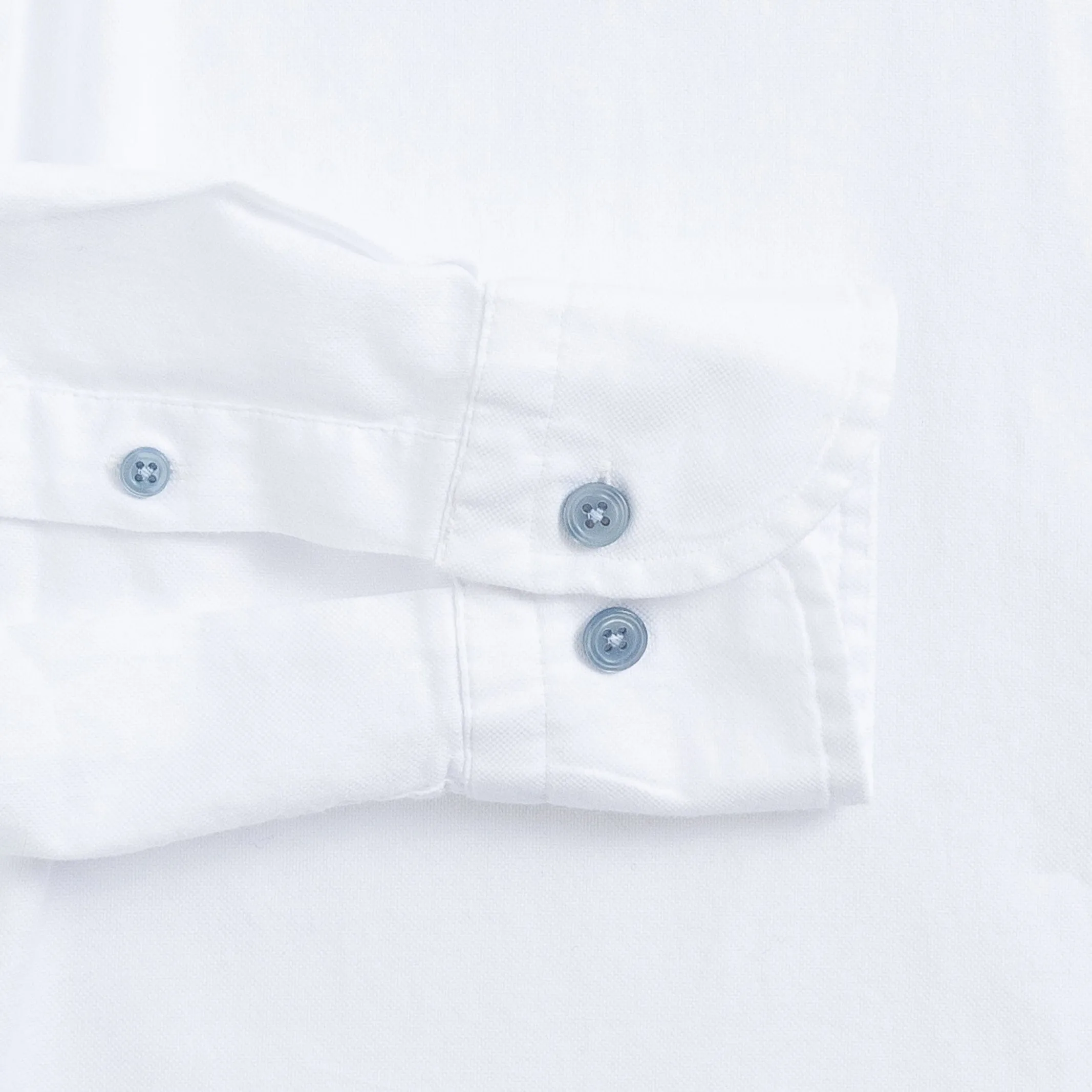 The White Asbury Oxford Soft Shirt with Blue Buttons